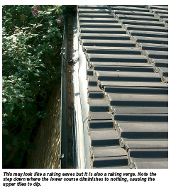 This may look like a raking eaves but it is also a raking verge. Note the step down where the lower course diminishes to nothing, causing the upper tiles to dip.
